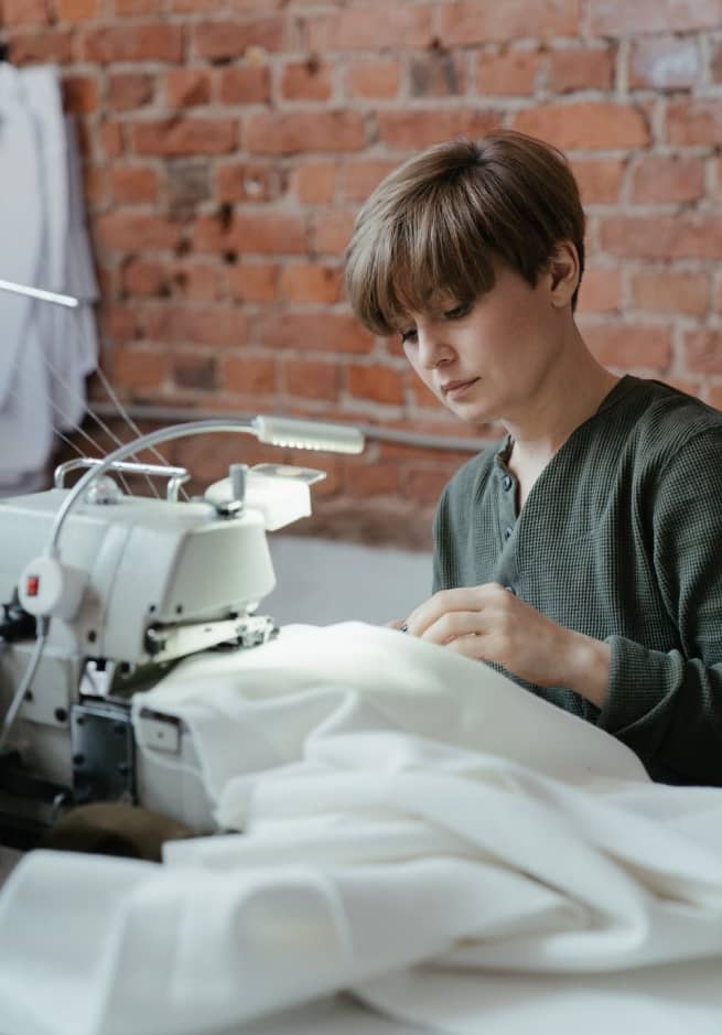 woman operating a sewing machine